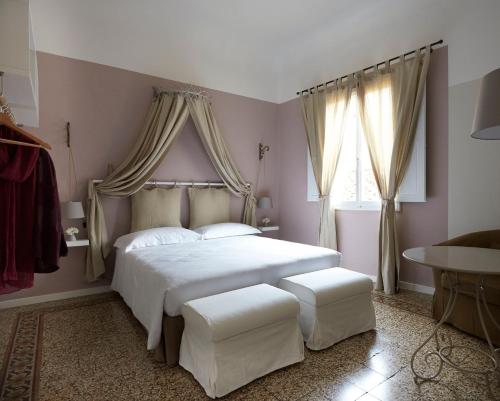 Ένα ή περισσότερα κρεβάτια σε δωμάτιο στο Yome - Your Home in Florence