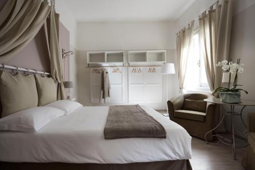 Ένα ή περισσότερα κρεβάτια σε δωμάτιο στο Yome - Your Home in Florence
