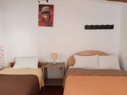 En eller flere senger på et rom på Killari Hostal Ollantaytambo