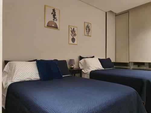 Katil atau katil-katil dalam bilik di Orange & Green Apartment - HP Sur