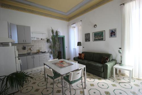 a living room with a couch and a table at Maddalena House in Spello