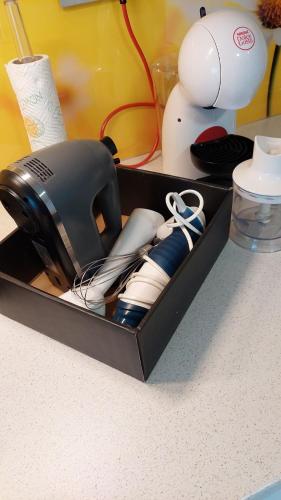 a black box filled with utensils on a counter at Apartma Marjetica in Gozd Martuljek