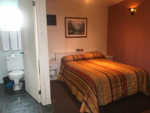 Katil atau katil-katil dalam bilik di Motel Le Voyageur