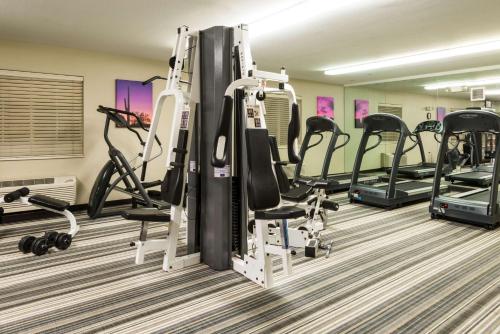 a gym with treadmills and elliptical machines at Sonesta Simply Suites Detroit Troy in Troy