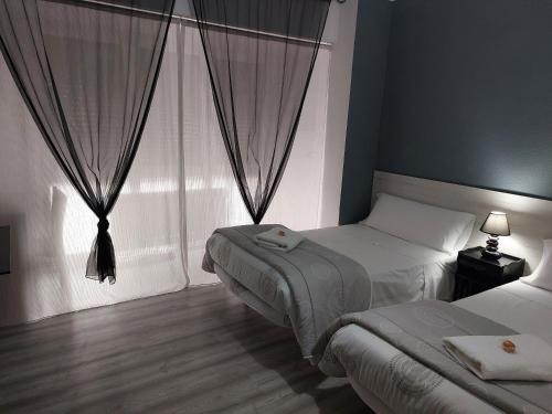 Katil atau katil-katil dalam bilik di Pensión Saint Mateo