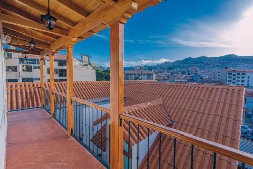 a balcony with a wooden roof with a view at Saska Boutique Hotel in Cusco