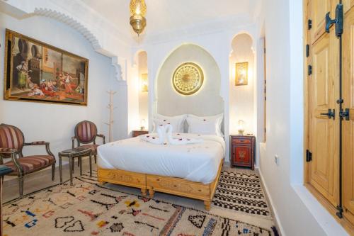 En eller flere senge i et værelse på Riad El Habib