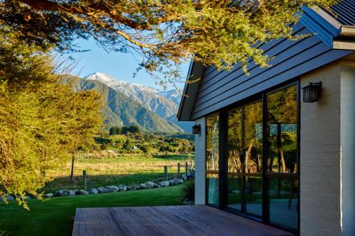 a house with a view of the mountains at Manakau Lodge in Kaikoura