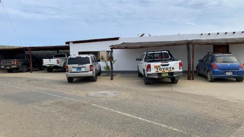 a couple of cars parked in a garage at Aloha Lobitos in Lobitos