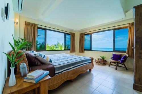 Ένα ή περισσότερα κρεβάτια σε δωμάτιο στο White Azure Villa Koh Phangan