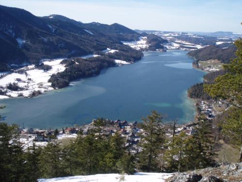 a view of a lake in the mountains at Pension Salzburger Hof in Fuschl am See