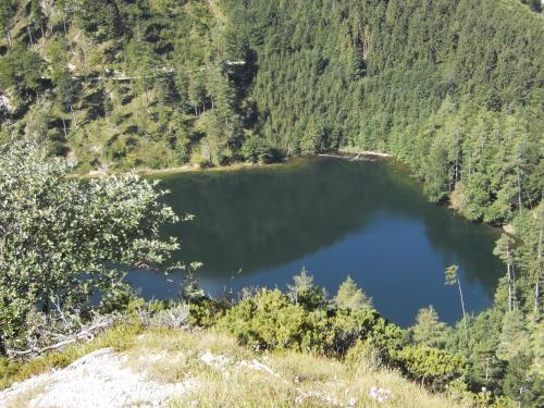 a large lake in the middle of a mountain at Pension Salzburger Hof in Fuschl am See
