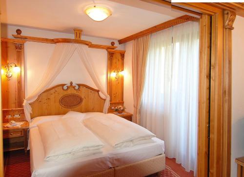 Postel nebo postele na pokoji v ubytování Hotel Lorenzetti