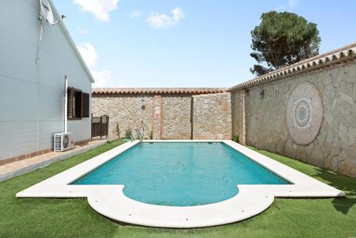 a swimming pool in the yard of a house at Villa Africa in La Muela