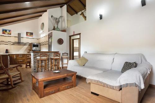 a living room with a couch and a table at Villa Africa in La Muela