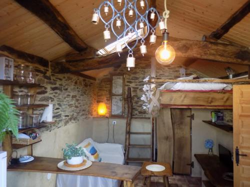 a room with a table and a bunk bed at Cabaña Bioxana in Molejón