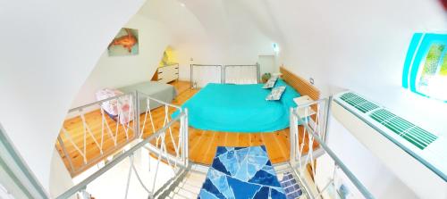 an overhead view of a room with a bed at Monolocale Azzurro Procida in Procida
