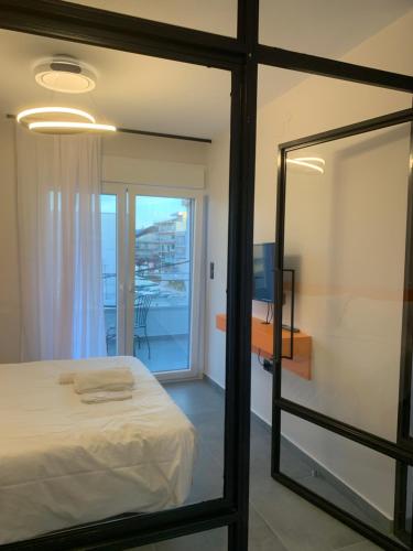 Posteľ alebo postele v izbe v ubytovaní IOANNINA SUITES