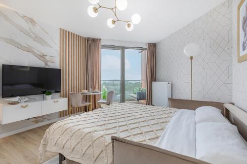 Postel nebo postele na pokoji v ubytování Premium Apartament PINEA Pobierowo