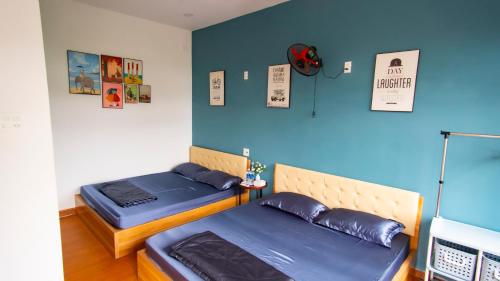 Ένα ή περισσότερα κρεβάτια σε δωμάτιο στο Toru Homestay