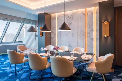 a conference room with a table and chairs at Steigenberger Hotel Doha in Doha