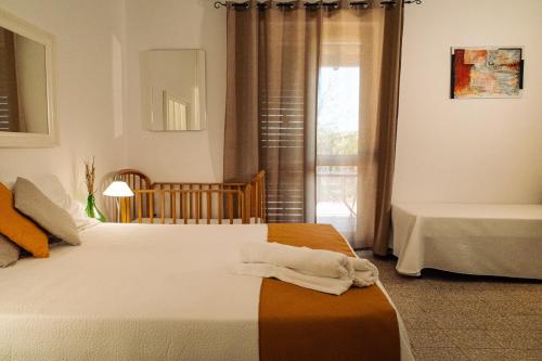 a bedroom with two beds and a window at Villa Irene Pisticci-Matera in Pisticci