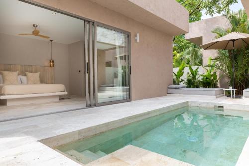 a pool in the backyard of a house with a bedroom at Cielo Boutique Hotel & Spa Samui in Bophut 