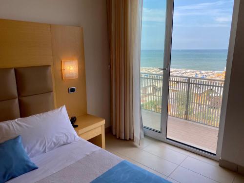 Postel nebo postele na pokoji v ubytování Hotel Granada