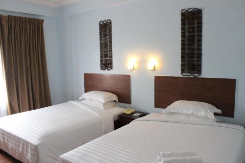 Postel nebo postele na pokoji v ubytování Hotel Maluri
