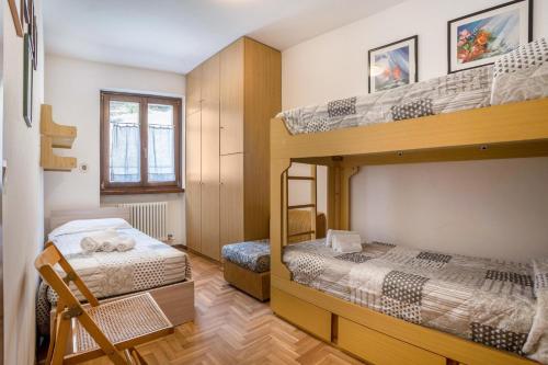 Un pat sau paturi într-o cameră la Appartamento Bellavista