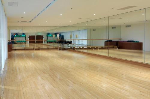 a bowling alley with wooden floors and mirrors at Radisson Blu Park Hotel & Conference Centre in Dresden