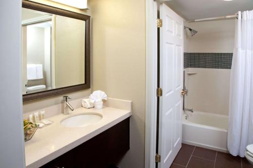 a bathroom with a sink, toilet and bathtub at Sonesta ES Suites Toronto Markham in Thornhill