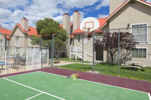 a tennis court with a ball on the court at Sonesta ES Suites Albuquerque in Albuquerque