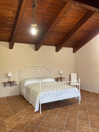 A bed or beds in a room at Masseria Le Zavattole