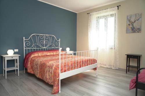 Кровать или кровати в номере Cascina Riva