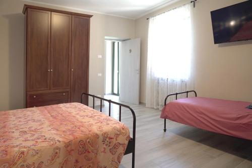 Postel nebo postele na pokoji v ubytování Cascina Riva