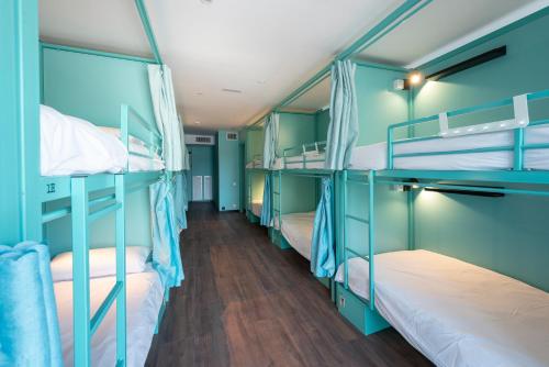 Ένα ή περισσότερα κρεβάτια σε δωμάτιο στο Hostelle - Women only hostel Barcelona