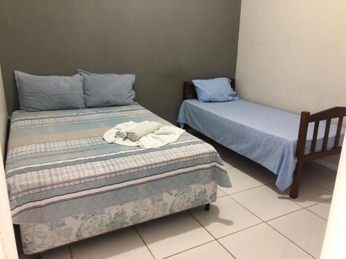 Tempat tidur dalam kamar di Pousada Cristo Rei