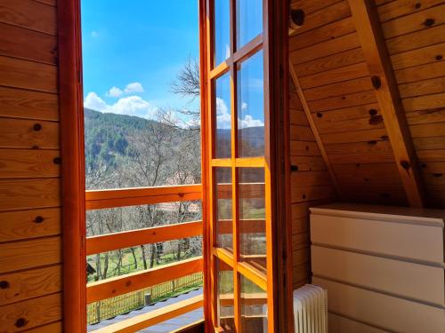 a room with a window with a view at Guest House Rankić in Mokra Gora