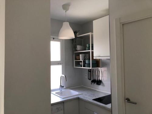A kitchen or kitchenette at Holidays2Malaga Alta Street 1 bedroom High Speed WIFI