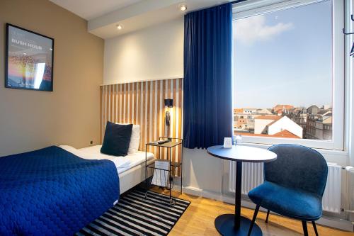Postel nebo postele na pokoji v ubytování Hotel Britannia