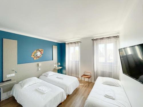 Postel nebo postele na pokoji v ubytování La Marine