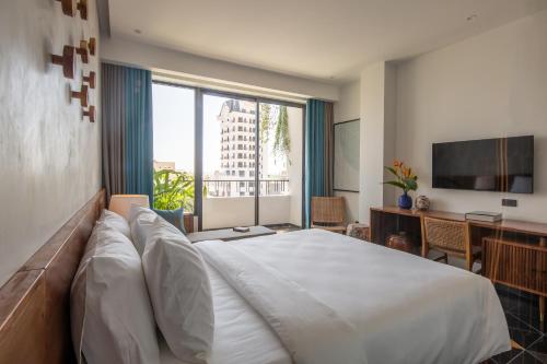 Katil atau katil-katil dalam bilik di Le Mint Hotel Quy Nhơn