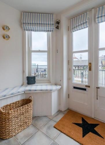 a room with a star on the floor next to a door at Beach House in Cromer