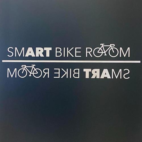 a sign with the words smart bike revision and two bikes at SmArt Hotel Bartolini in Montecatini Terme