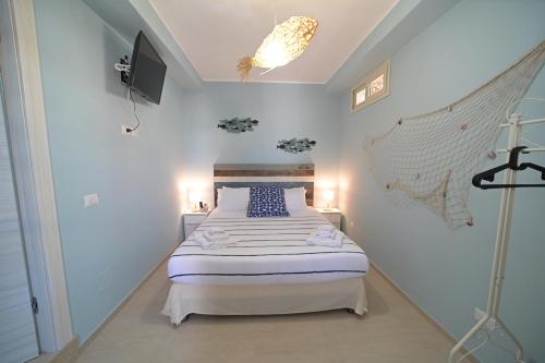 Кровать или кровати в номере Villa Borgo dei Pescatori