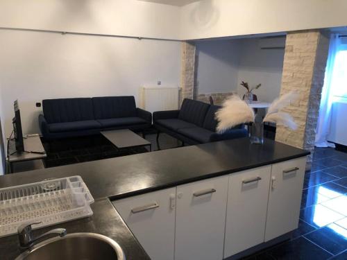 a living room with a couch and a table at Luxury Apartments Christos in Gouvia