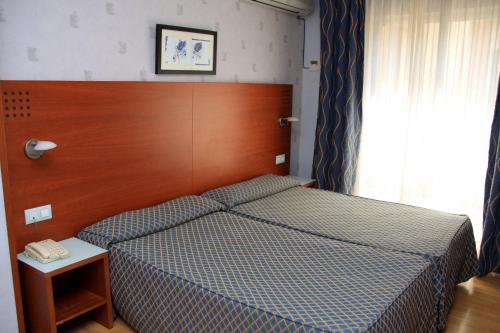 Cama o camas de una habitación en Hotel Xauen