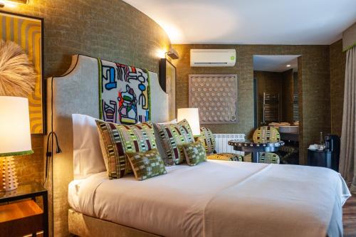 a hotel room with a bed with pillows at Montargil Monte Novo in Montargil