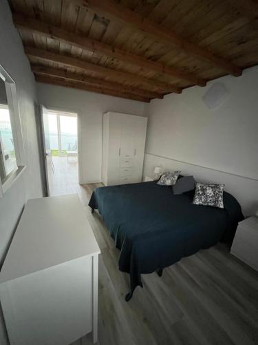 A bed or beds in a room at Avenida central